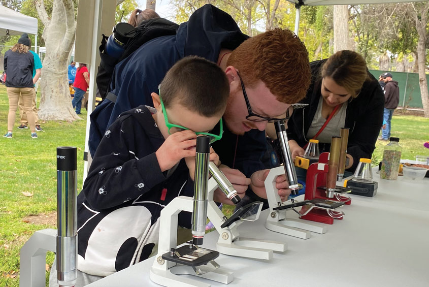 Kids look through microscopes in zoo