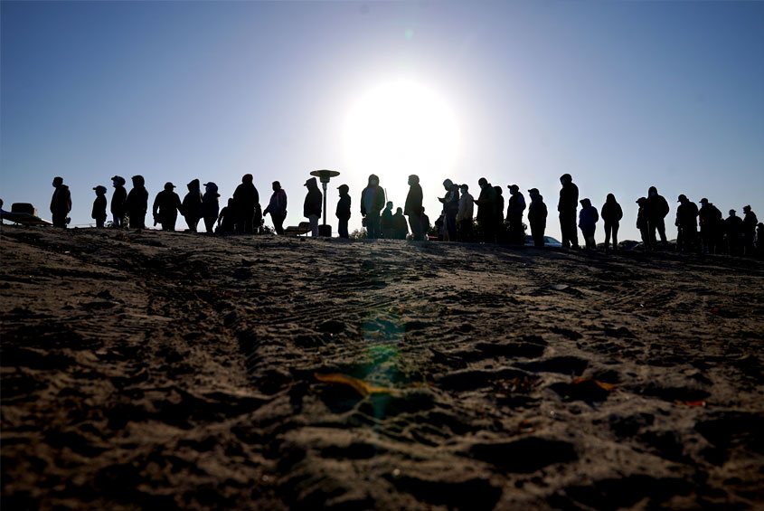 people waiting in line to get vaccinated