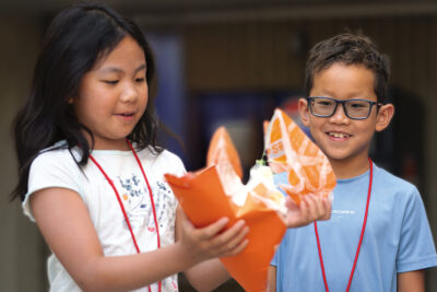 Campers testing an egg shield