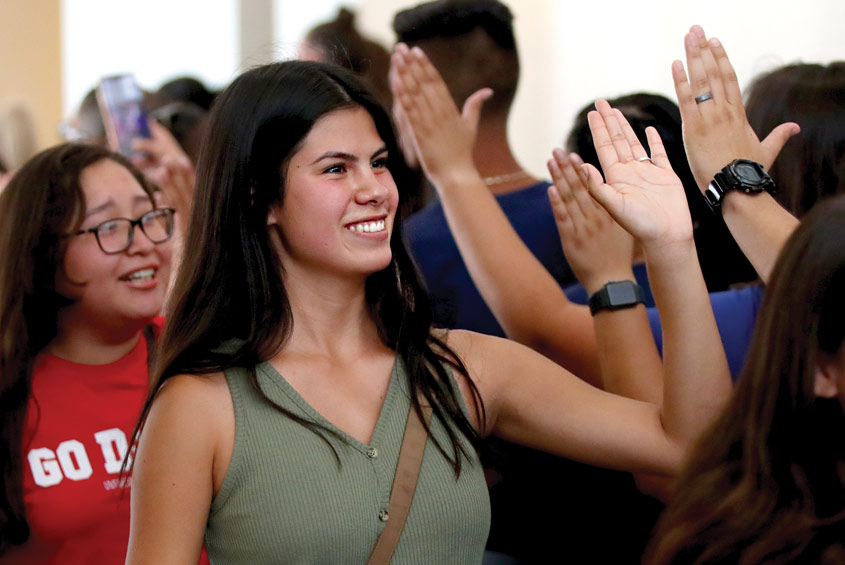 Student highfives